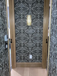 a doorway with a black and white pattern on it